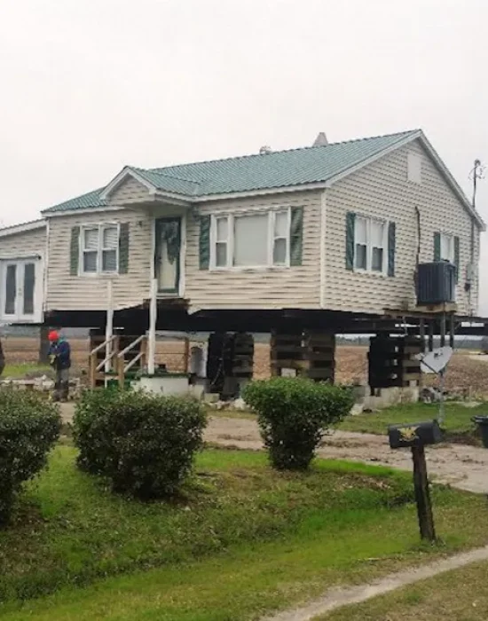 stilt house with stairs and aircondition Elite Structural Movers, Inc.