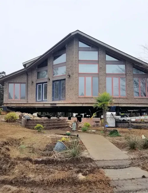 stilt triangular house Elite Structural Movers, Inc.