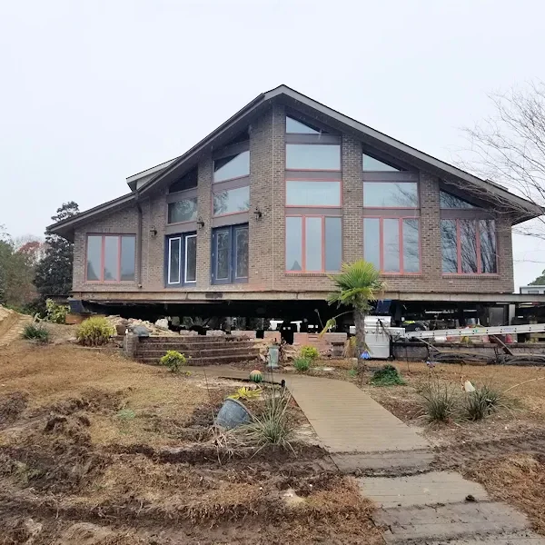 stilt triangular house Elite Structural Movers, Inc.